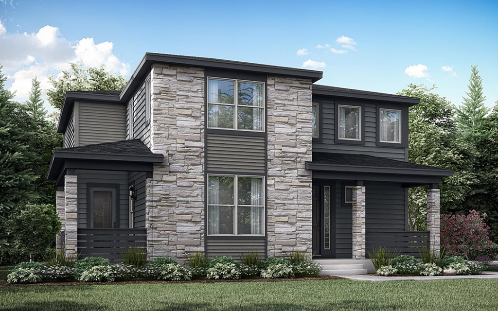 Two-story modern house with stone and dark siding exterior, multiple large windows, a small covered porch, and landscaped front yard with shrubs and grass. Nestled in Sterling Ranch Colorado, southwest of Denver, the home features beautiful trees and a blue sky in the background.